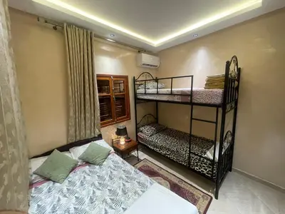 a bedroom with two bunk beds in a room at Dar Chrif in Marrakech