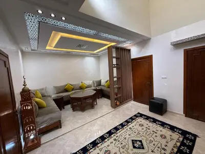 a living room with a couch and a table at Dar Chrif in Marrakech