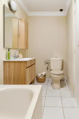 a bathroom with a toilet and a sink and a tub at Villa Kalthoum in Marrakech
