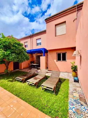 a group of benches in front of a building at Villa Kalthoum in Marrakech