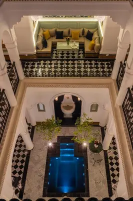 an overhead view of a swimming pool in a building at Riad Espoir Spa Logement entier in Marrakech