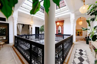 a balcony with black railings in a building at RIAD DAR C in Marrakech