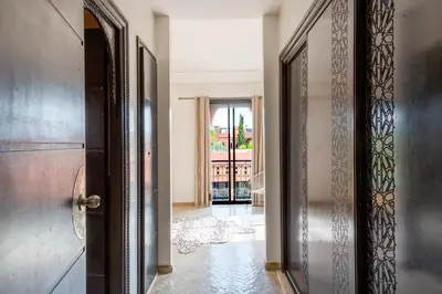 an open door in a room with a hallway at Magnifique villa de 320 m2 avec 2 piscines in Marrakech