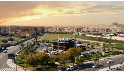 a view of a city with a parking lot and buildings at Basic appartement avec Parking in Marrakech