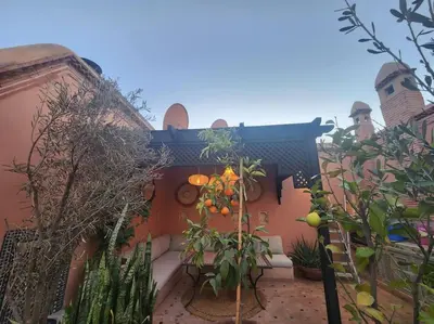 a building with a bunch of plants in front of it at Riad M. Jacuzzi - Piscine Arty/Cosy - Privatif in Marrakech