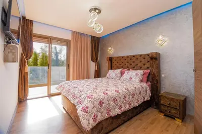 a bedroom with a bed and a large window at pearl garden marrakech in Marrakech