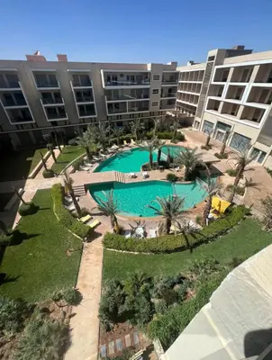 an overhead view of a swimming pool in a building at pearl garden marrakech in Marrakech