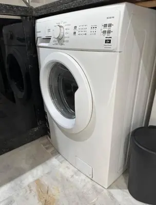 a white washer and dryer in a room at Super appartement au cœur de Marrakech in Marrakech