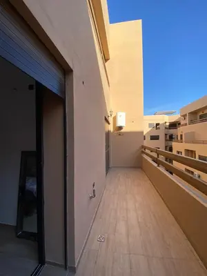 a balcony of a building with a door open at Appartement de luxe Marrakech Gueliz in Marrakech