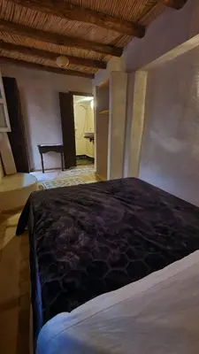 a bedroom with a large bed in a room at Beldi Riad in Marrakech