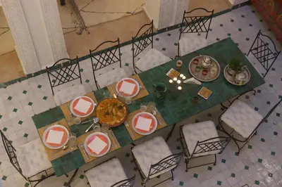 an overhead view of a dining table and chairs at Riad Jenan L'mouassine in Marrakech
