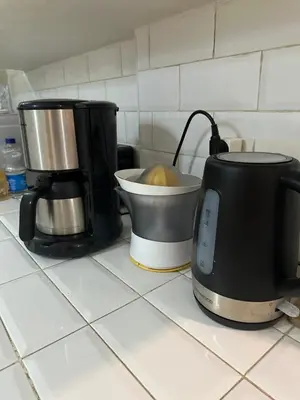 a kitchen counter with a coffee maker and a blender at Riad Le Manzil Beldi in Marrakech