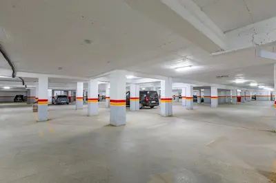 an empty parking garage with columns and cars in it at Chic & Cosy Appart au Centre Ville - 100 % Équipé in Marrakech