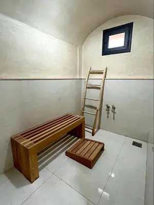 a room with a ladder and a bench in it at Belle et spacieuse villa au Golf Amelkis Marrakech in Marrakech
