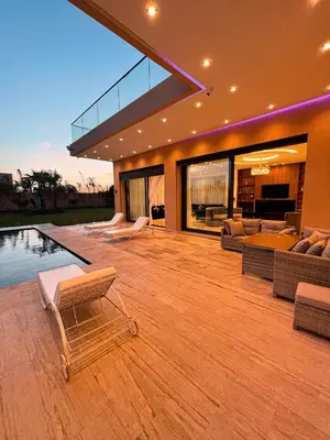 a living room with a pool and a house at Villa 7palms in Marrakech