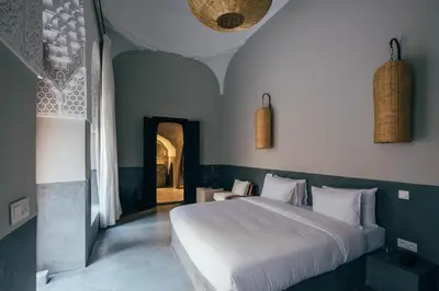 a bedroom with a large white bed in a room at Riad no37 in Marrakech