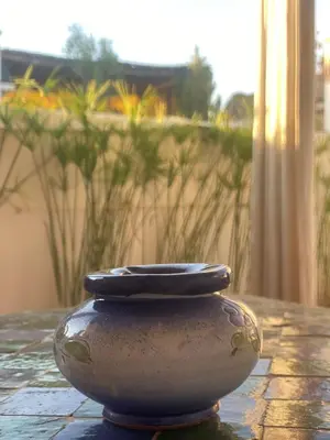 a vase sitting on top of a table at Riad Dar Teranga Hotel & Spa in Marrakech