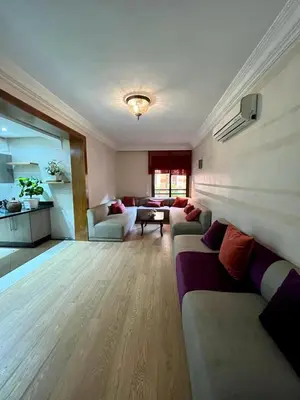a large living room with couches and a table at Appartement chambre salon a l'hivernage 9 in Marrakech