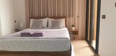a bedroom with a bed with two towels on it at Apparemment wafaa in Marrakech