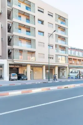 a large building on a street in front of a road at NEW! Luxe et moderne en plein Guéliz, Terrasse in Marrakech