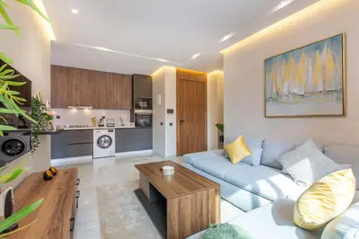 a living room with a couch and a table at New ! Stunning and Comfortable apartement in Marrakech