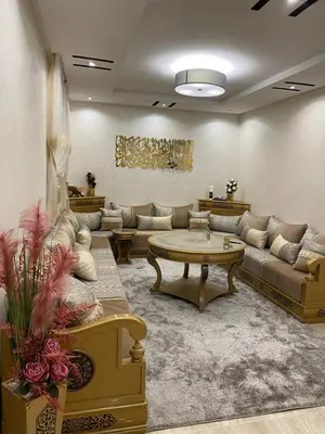 a living room with couches and a coffee table at Appartement a loué pour les familles in Marrakech