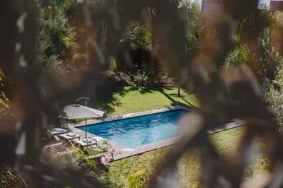 an overhead view of a swimming pool in a yard at Villa de luxe Sahara in Marrakech