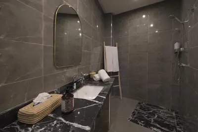 a bathroom with a sink and a mirror at Riad l'Esprit des Patios & Spa in Marrakech