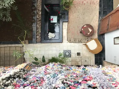 a pile of flowers on the side of a building at Riad Dar Dallah in Marrakech