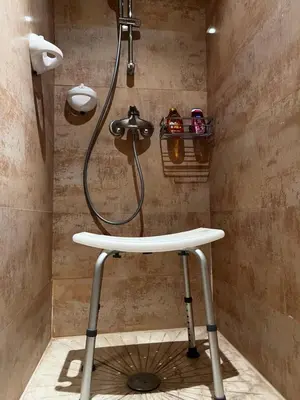 a bathroom with a shower with a sink at Beautiful, great equipped 122 m holiday apartment near Majorelle Garden and Gueliz with pool views and a large balcony and terrace in Marrakech