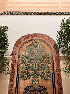 a door with a painting on a wall at Riad Black Doors in Marrakech