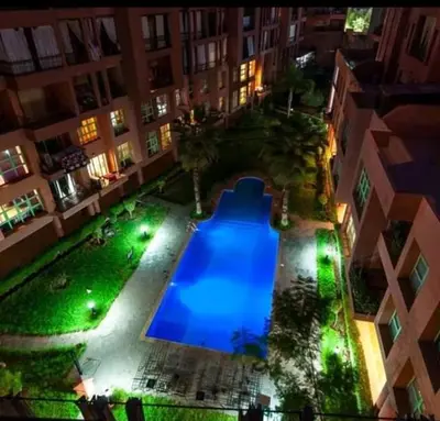 an overhead view of a swimming pool in a building at night at Propre appartement à loué pour les familles in Marrakech