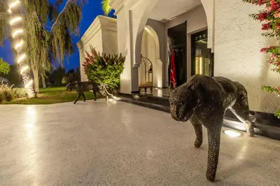 a statue of an elephant in front of a house at Palais Anthea Boutique Hotel & Spa in Marrakech