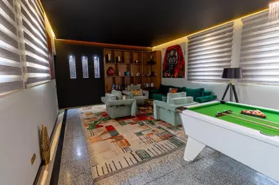 a living room with a pool table in the middle at Palais Anthea Boutique Hotel & Spa in Marrakech