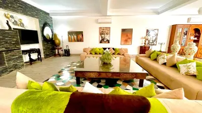 a living room with couches and a coffee table at Villas Green in Marrakech