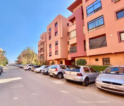 a row of cars parked next to a building at Appartement Dalila in Marrakech
