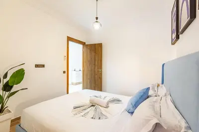 a bedroom with a white bed and a window at Magnificent Apartment in Gueliz - 100% Equipped in Marrakech