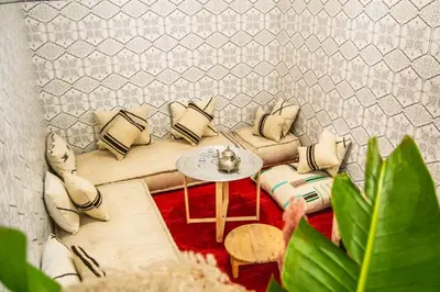 a living room with a couch and a table at Riad Fz Marrakech in Marrakech