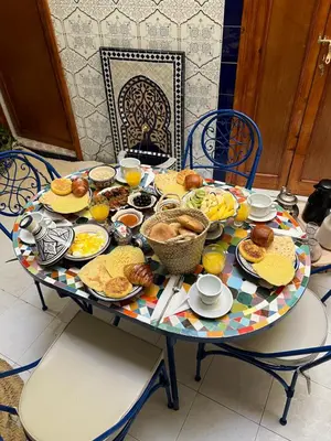 a table full of breakfast food on a table at Riad Fz Marrakech in Marrakech