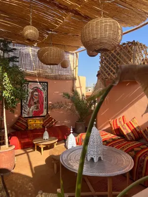 a living room with a couch and a table at Riad Fz Marrakech in Marrakech