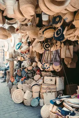 a display of straw hats and baskets in a store at Magnifique Duplex à Marrakech in Marrakech