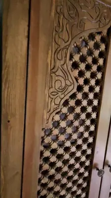 a close up of a wooden door with a pattern at Riad with Outdoor Swimming Pools in Marrakech