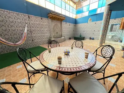 a table and chairs in a large room with a table and chairsktop at Marrakech aRt in Marrakech