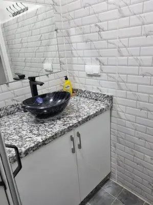 a bathroom with a black sink on a counter at proche aéroport, idéal pour travailler in Marrakech