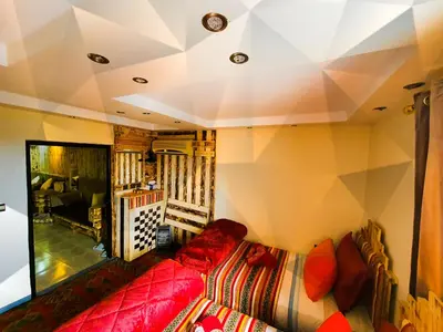 a living room with a couch and a tv in a room at Appartement funny house a place jamaa el fna de marrakech in Marrakech
