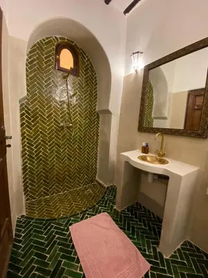 a bathroom with a sink and a mirror at Riad Musa in Marrakech