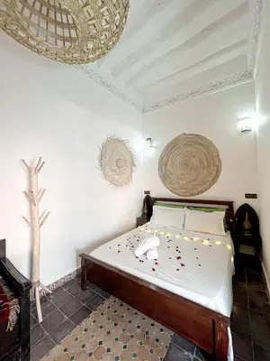 a bedroom with a bed in a room at Riad Musa in Marrakech