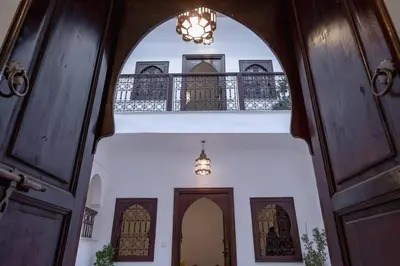 an entrance to a house with a chandelier at Paisible riad privatif au cœur de Marrakech in Marrakech