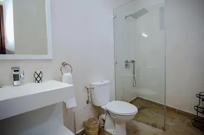 a bathroom with a toilet and a sink and a shower at Paisible riad privatif au cœur de Marrakech in Marrakech