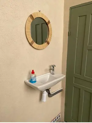 a bathroom sink with a mirror on the wall at Happy Marrakchy in Marrakech